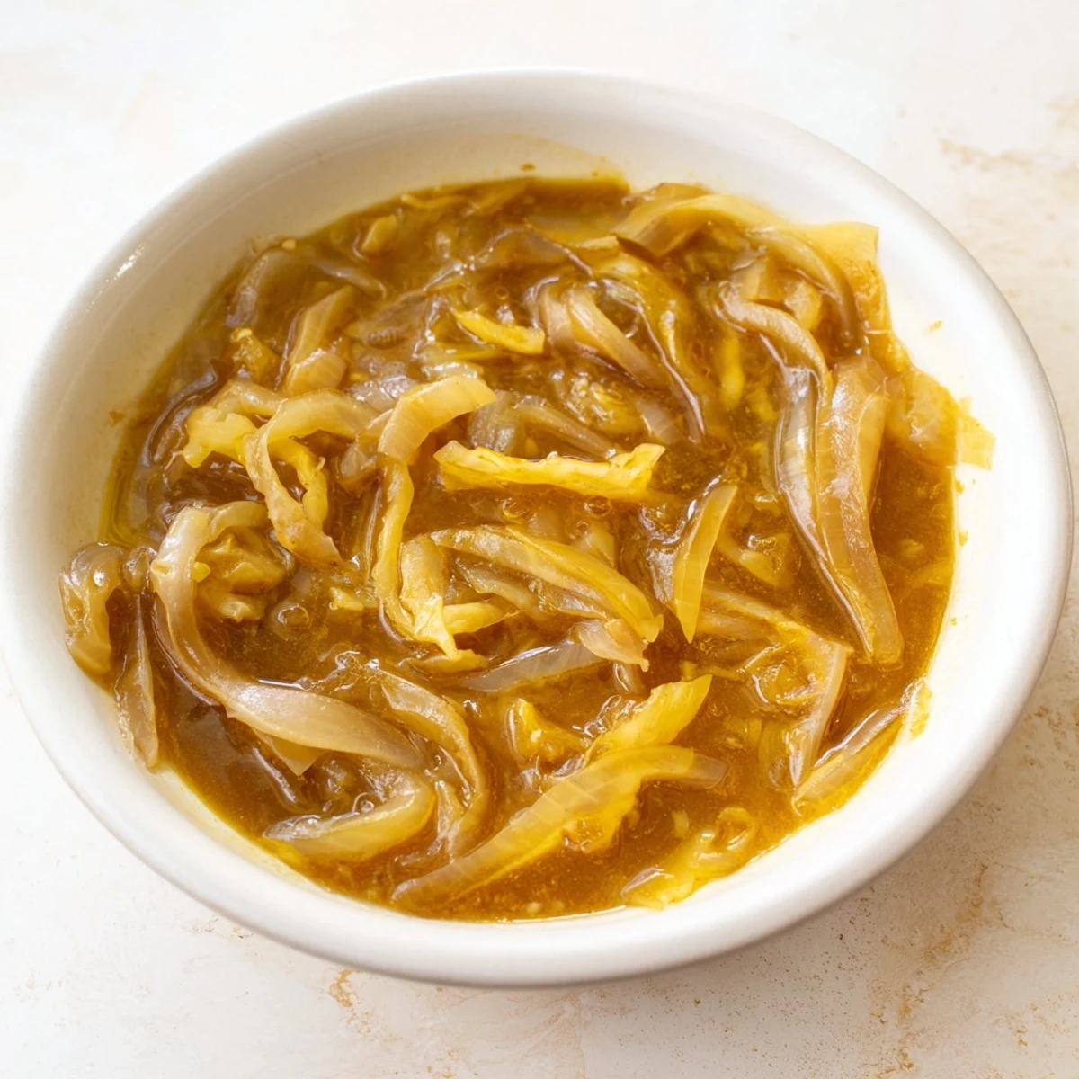 Golden caramelized onions and melted cheese creating a comforting German Cheese and Onion Beer Soup.