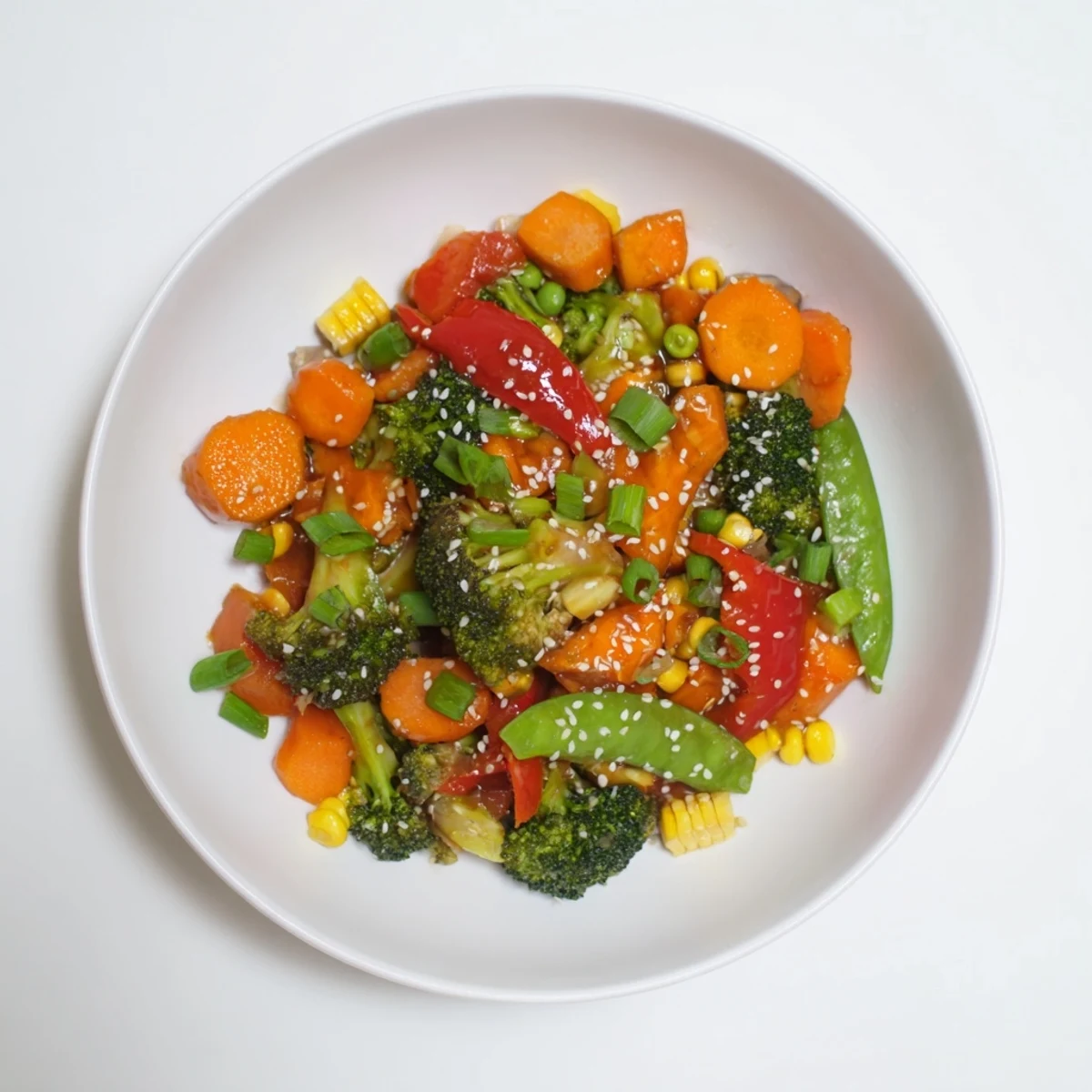 A flavorful bowl of Colorful Vegetable Stir-Fry, with a sprinkle of sesame seeds, ideal over rice or noodles.