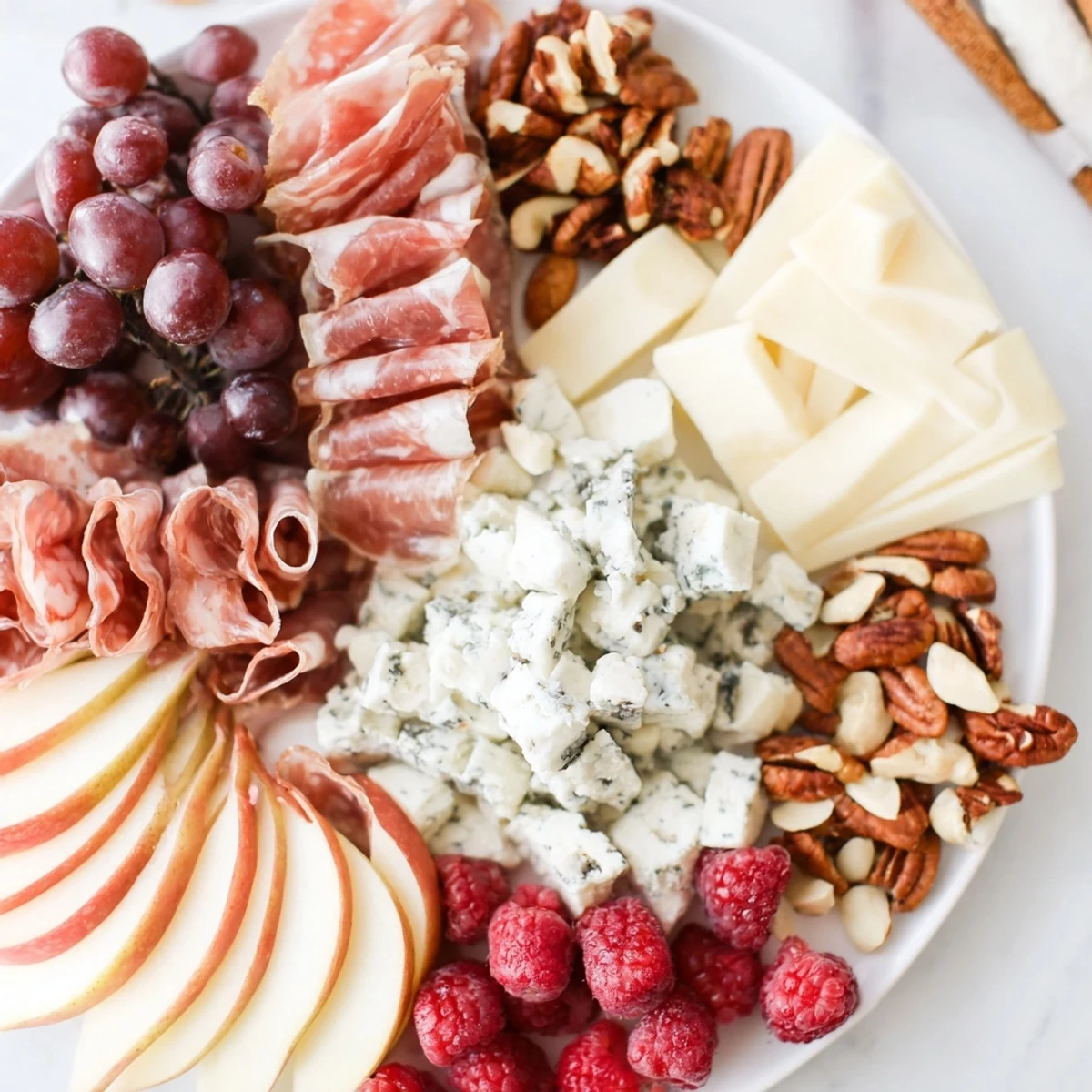 Elegant Lace & Pearls grazing board with Brie, charcuterie, fruit, and artisan crackers, ready to serve.