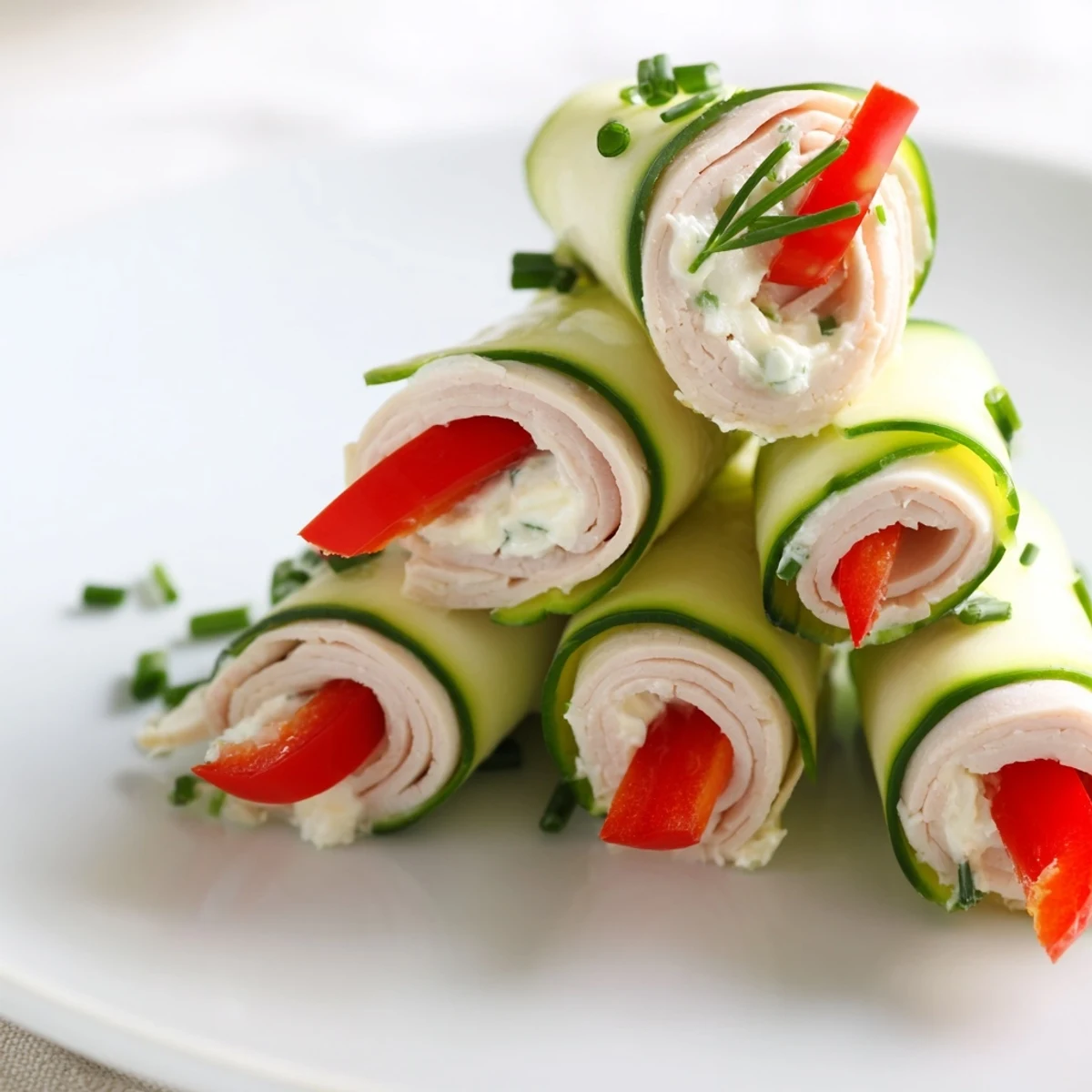 Creamy cheese and colorful bell peppers fill these quick and easy turkey roll-ups for a tasty lunch.