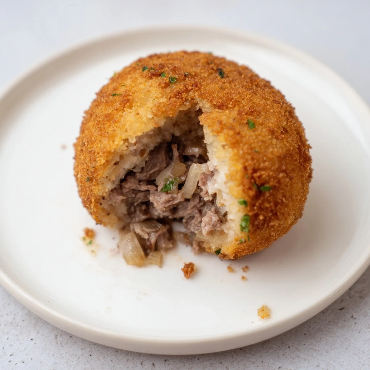 Golden-brown, crispy Dutch croquettes with a creamy beef interior, ready to serve hot.