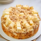 Close-up of a freshly baked German apple cake, a delicious dessert with a buttery crumble.