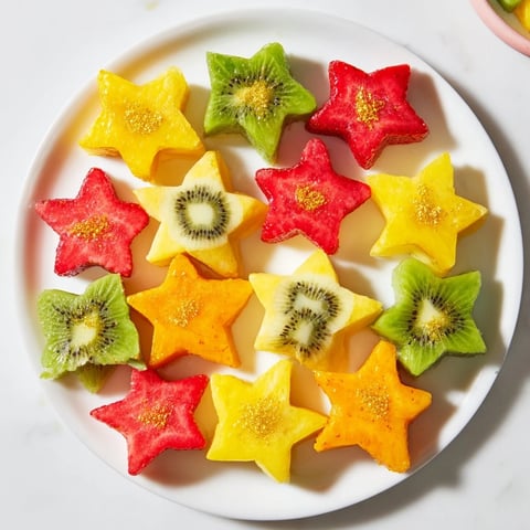 Festive midnight kiss star and heart cocktail garnishes with fruit, ready to add to holiday drinks.