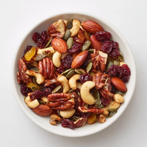 A large bowl of Nutty Nosh Squirrel Snack Mix, offering a sweet and spicy aroma.