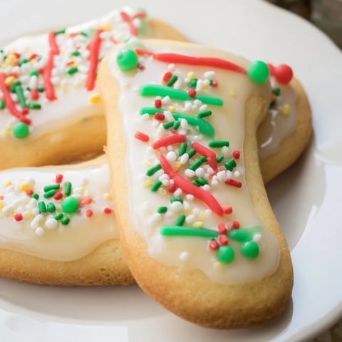 Buttery Christmas boot-shaped delights: freshly baked cookies, beautifully iced and ready for the holidays.