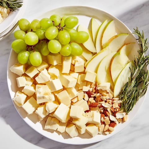 A beautifully arranged book club pairing platter, showcasing cheeses, meats, and fruits.