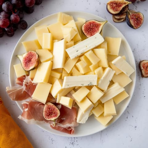 Taste the delightful canapés, cheeses, and charcuterie of Moments Magiques Plateau Bonne Année 2026.