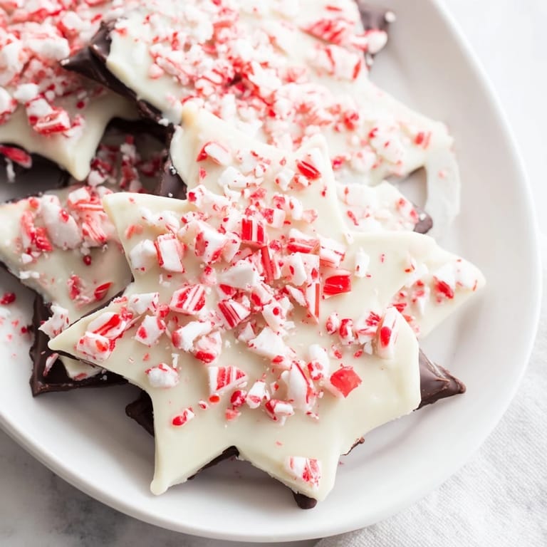 Beautifully crafted Peppermint Bark Snowflakes, a classic holiday dessert, ready to be enjoyed or shared with loved ones.