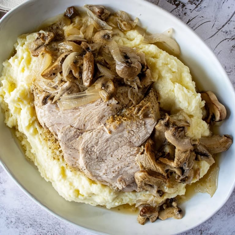 Elegant The Ghostly Gala recipe presentation: tender chicken, creamy purée, and dark pepper shadows.