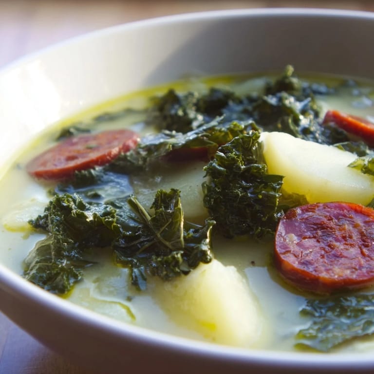 Close-up of freshly prepared Portuguese Caldo Verde, a delicious soup with a flavorful, rich broth.
